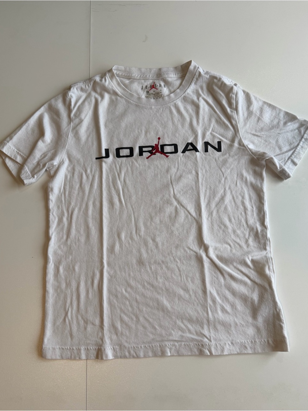Jordan White Short Sleeve Tee with Red Jumpman and Black Wordmark